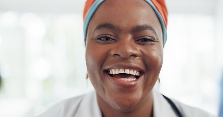 Image showing Happy, smile and face of a doctor in the hospital lobby after healthcare or medic consultation. Happiness, excited and portrait of black woman medical nurse standing in the hallway of medicare clinic