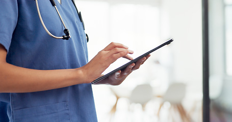Image showing Digital tablet, healthcare and doctor doing research in the hospital before a consultation. Technology, nurse or medical worker scrolling on mobile device to analyze test results in a medicare clinic