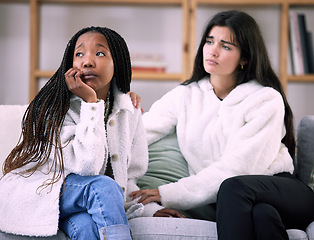 Image showing Sad, friends and worry with women on sofa in living room for comfort, grief and depression. Mental health, emotional support and care with girl consoling at home for solidarity, advice and sympathy