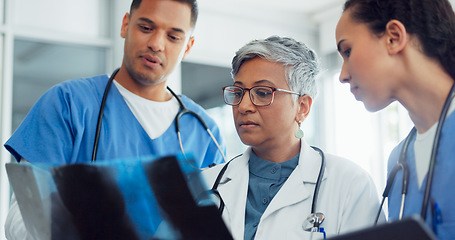 Image showing Doctor, x ray and collaboration with a woman surgeon and team talking about diagnosis in a hospital. Medical, teamwork and healthcare with a female medicine professional training interns in a clinic