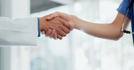 Image showing Handshake, doctor and nurse with teamwork, partnership and thank you for healthcare service, meeting and hospital onboarding. Medical worker team or employees shaking hands for clinic welcome