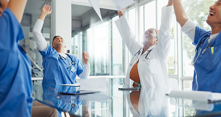 Image showing Win, success and doctors with paper in a meeting, medical breakthrough and celebration of healthcare with applause. Celebrate medicine, training smile and employees in a seminar for an achievement