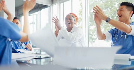 Image showing Win, success and doctors with paper in a meeting, medical breakthrough and celebration of healthcare with applause. Celebrate medicine, training smile and employees in a seminar for an achievement