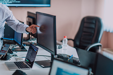 Image showing Programmers engrossed in deep collaboration, diligently working together to solve complex problems and develop innovative mobile applications with seamless functionality.