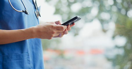 Image showing Hands of woman, smartphone and nurse in hospital for telehealth or online consultation. Healthcare, cellphone and physician with mobile phone for research, wellness app or checking medical email.