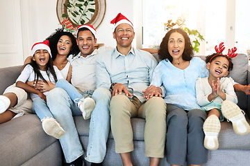 Image showing Christmas, portrait and smile of big family on sofa in home living room, bonding and laughing at funny joke. Love, xmas holiday and care of happy children, parents and grandparents sitting on couch.