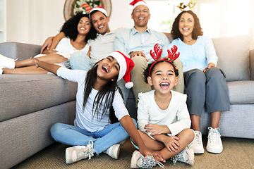 Image showing Christmas, smile and portrait of big family on sofa in home living room, bonding and laughing at funny joke. Love, xmas holiday and care of happy children, parents and grandparents sitting on couch.