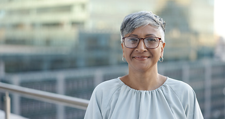 Image showing Senior corporate woman, face and rooftop in city with smile, happy and success by New York skyline. Executive manager, happiness and vision in metro with buildings, sunshine and goals in accounting