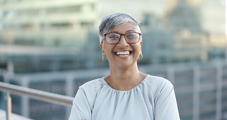 Image showing Senior corporate woman, face and rooftop in city with smile, happy and success by New York skyline. Executive manager, happiness and vision in metro with buildings, sunshine and goals in accounting