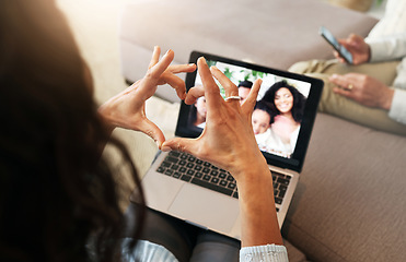 Image showing Hand heart, video call and love with laptop screen, family and communication with emoji, connection and bonding. Hands, relax at home and happy with care, connectivity and virtual chat in lounge