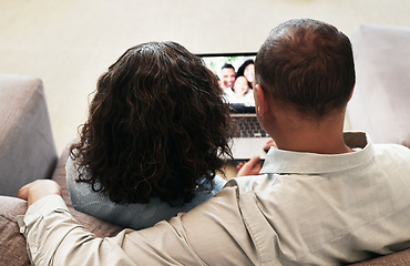 Image showing Laptop, couple and video call on home sofa for communication, network connection and webinar. Man and woman grandparents in lounge with app for virtual conversation, distance family chat or to relax