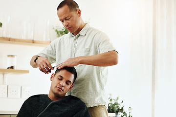 Image showing Haircut, barber and man hair stylist cutting a client in a barbershop for grooming service for customer in a salon. Male, hairdresser and person gets a trim or hairdo during appointment