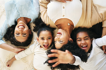 Image showing Bed, top view and grandma, mother and children smile for bonding, quality time and love in bedroom. Big family, happy and portrait of grandmother, mom and girls in bedroom relaxing together at home