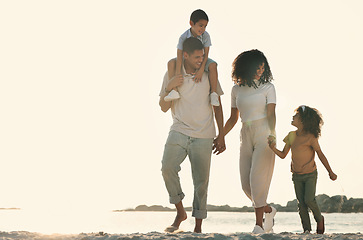 Image showing Happy, holding hands and walking family on the beach for travel, bonding and quality time in Brazil. Sunset, mockup and parents with children on a walk by the ocean for playing, vacation and break