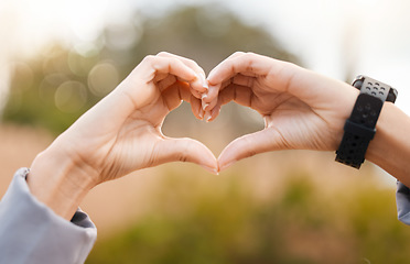 Image showing Heart hands, outdoor and fitness health for cardiology exercise, running or wellness closeup. Like, workout and healthy person with love sign and smart watch in park or nature for care emoji