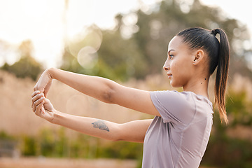 Image showing Fitness, health and woman stretching arms in nature to get ready for workout, training and exercise. Sports, thinking and female stretch hands and warm up to start exercising, cardio and running.