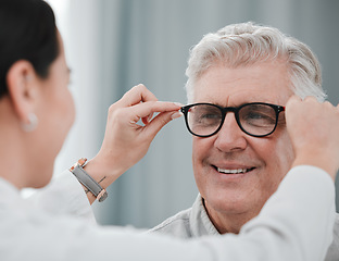 Image showing Optometry, ophthalmology and optometrist fitting glasses on senior man patient or happy client during appointment. Doctor, consultation and eyewear or spectacles for an elderly male for vision