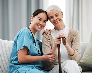 Image showing Nurse, elderly woman and sofa for portrait, walking stick and smile together with happiness, chat and care. Senior patient, asian doctor and couch with helping hand, happy and connection for support