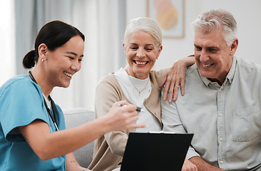 Image showing Nurse, healthcare and support with a senior couple in their home, talking to a medicine professional. Medical, insurance or life cover with a mature man and woman meeting a medicine professional