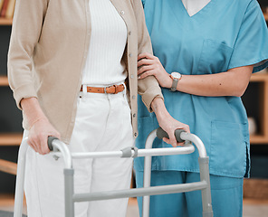 Image showing Nurse or senior hands on walking frame for support, help or trust moving legs in rehabilitation. Physiotherapy healthcare, elderly nursing or medical caregiver consulting disabled patient