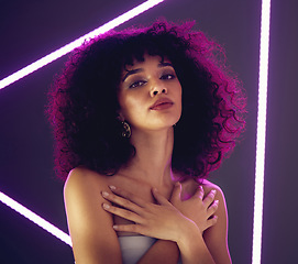 Image showing Purple light, beauty and portrait of a woman in studio with neon uv for makeup, cosmetics and self love. Face of aesthetic gen z model black person on gray background for natural art glow and fashion