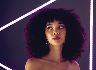 Image showing Beauty, purple light and a woman in studio with neon uv for makeup, skin cosmetic and self love. Face of aesthetic gen z black person model on a background for natural afro or art glow and fashion