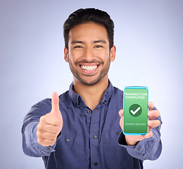 Image showing Asian man, phone and thumbs up in payment received ecommerce, transaction or internet banking success. Portrait of happy male showing smartphone screen with thumb emoji, yes sign or like for purchase