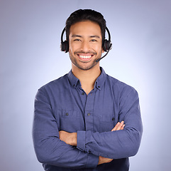 Image showing Arms crossed, call center and smile with portrait of man for customer service, business and technical support. Networking, communication and contact us with employee for sales, crm or happy in studio