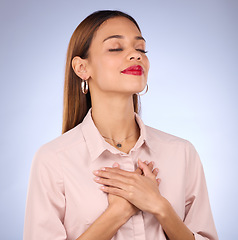 Image showing Hands on chest, heart and self love with woman against studio background, content and with gratitude for health. Wellness, young female and calm with eyes closed, inner peace and zen with mindfulness