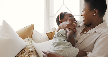 Image showing Happy family, mother and child play in a house with love, laughing and freedom on a sofa in a living room. Smile, girl and funny mama enjoy having fun, bonding and tickling quality time together