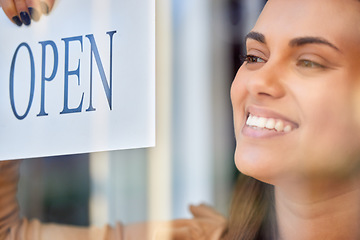 Image showing Open sign, happy woman or small business owner with shopping, customer service and retail startup career. Entrepreneur, manager or person smiling with board for welcome in new store at window or door