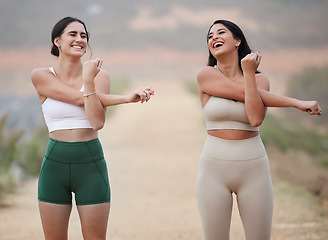 Image showing Stretching, laughing and women in nature, workout and wellness with smile, balance and motivation. Female athletes, friends and happy girls stretch arms, training outdoor and warm up for practice