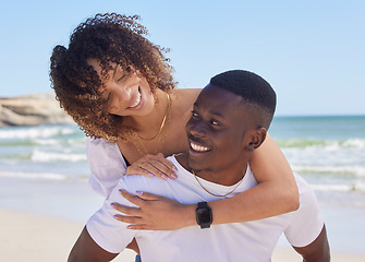 Image showing Black couple, hug and smile for piggyback at the beach in summer vacation, bonding or embracing romance. Happy African American man giving woman back ride smiling for love, travel and holiday at sea