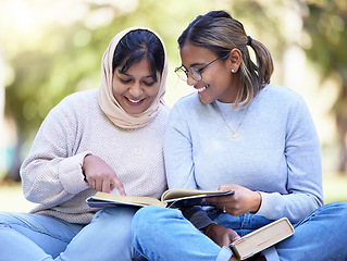 Image showing Study friends, park reading and outdoor woman students with university textbook and books. College female, girl friend and muslim young person learn on a outdoor campus with a smile from studying