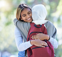 Image showing Happy muslim students, park or hug with backpack in garden or school campus bonding, friends acceptance or community support. Smile, Islamic or women in embrace, fashion hijab or university college