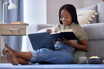 Image showing Student, writing and black woman with book in home living room for elearning, studying and knowledge. Laptop, education and smile of happy female with notebook for notes, information and research.