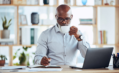 Image showing Business, black man and drinking coffee while writing in notebook, schedule and strategy at office desk. Mature entrepreneur planning notes, information and journal of planner, agenda and reminder