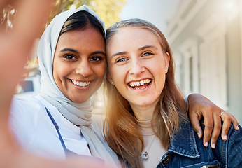 Image showing Selfie, friends and women, hug and outdoor with freedom, carefree and cheerful together in town. Portrait of Muslim girls with joy, smile and ladies embrace, happiness and reunion on summer break
