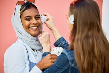 Image showing Women, muslim and friends portrait with flower decoration, spring celebration or bonding in city. Young student, gen z girl and islam with smile, happiness and fashion for urban adventure for support