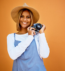 Image showing Smile, camera and photographer with portrait of woman for creative, retro and shooting photos. Fashion, happiness and vintage with girl and photography for picture, lens and focus in wall background