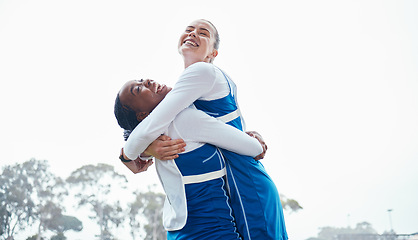 Image showing Hug celebration, sports success or team support in netball training game or match with goals on court. Teamwork, fitness friends or excited young athlete girls with happy smile or winning together