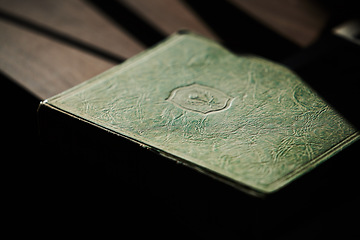 Image showing Education, learning and book on a table for law studying or knowledge for university studying. Library, scholarship or desk in a college with literature in a vintage cover for legal research