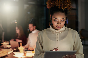 Image showing Night business, black woman and tablet in office for planning, research and productivity. Young female working late on digital technology for strategy data, information analysis or dark startup ideas