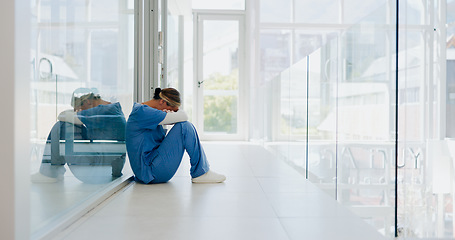 Image showing Doctor, stress and woman with depression, burnout and overworked in hospital, deadline and tired. Healthcare, medical professional and nurse crying for mistake, depressed and fatigue with anxiety