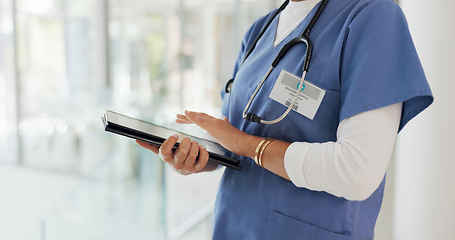 Image showing Digital tablet, research and woman doctor analyzing results from a health test in hospital. Technology, touchscreen and female healthcare worker researching medical treatment or medication in clinic.