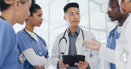 Image showing Asian doctor, nurses and tablet in meeting, surgery planning or low angle feedback in research hospital. Talking, diversity and healthcare people on technology, teamwork and leadership collaboration