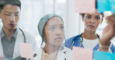 Image showing Meeting, medical and collaboration with a doctor black woman coaching her team on glass in a hospital. Planning, training or healthcare with a female medicine professional talking to a clinic group