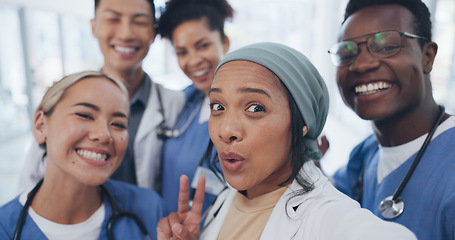 Image showing Doctors, friends and selfie in hospital for team building, solidarity or diversity for social media post. Doctor, group and teamwork with black man, women and peace for comic smile, happy and support