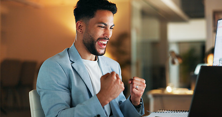 Image showing Happy businessman, laptop and celebration for winning, deal or promotion at the office desk. Excited male celebrating victory, win or bonus for sales achievement working on computer at the workplace