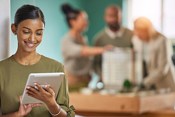 Image showing Tablet, research and creative with an architect woman at work in her engineering office for architecture. Building, internet and construction with a female designer searching for blueprints online